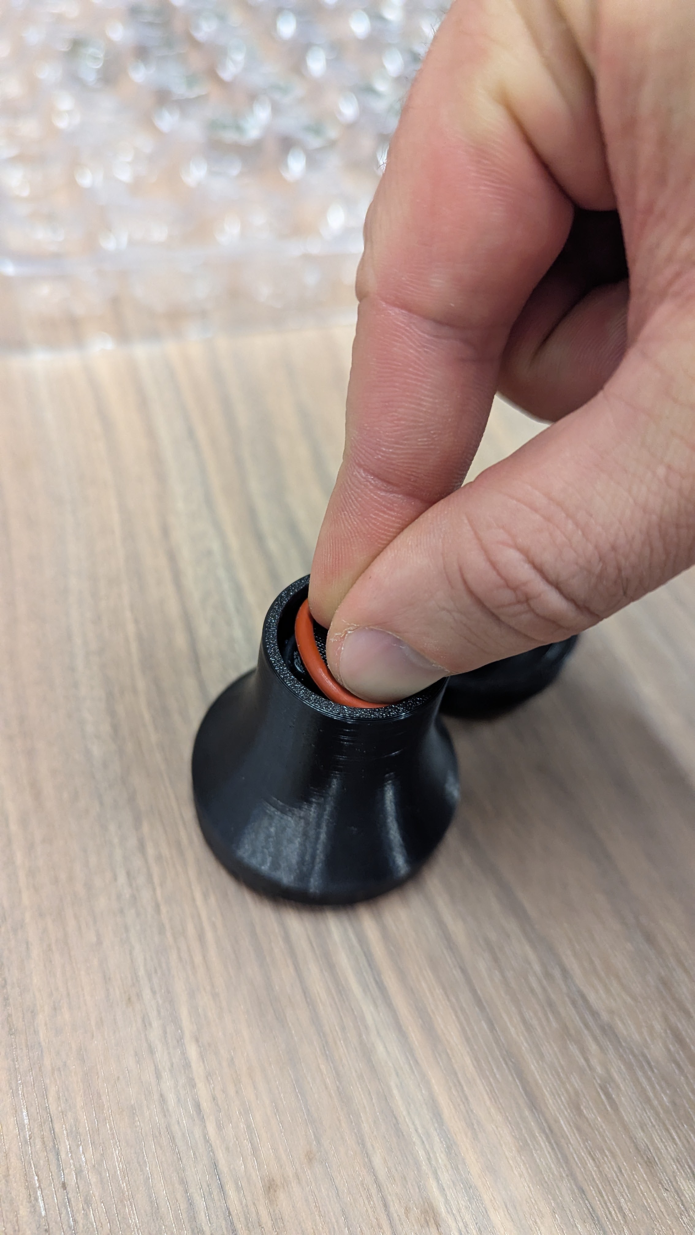 Setting new O-ring on handle bottom and pressing into slot